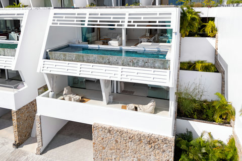 Architectural exterior of multi-level oceanfront villa with private terraces in Koh Samui Thailand