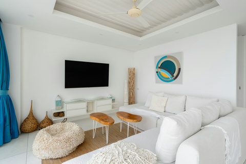 Outdoor dining terrace with panoramic ocean views and designer lighting at Villa Ocean Serenity