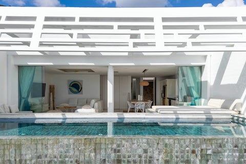 Private pool deck with lounge seating and turquoise ocean backdrop at Villa Ocean Serenity Thailand
