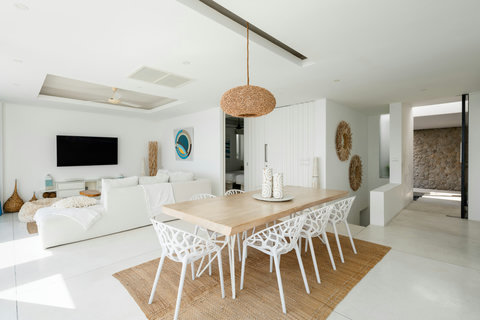 Bright open-plan living and dining area with vaulted ceilings and wooden beams, Koh Samui villa