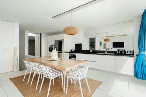 Fully equipped gourmet kitchen with modern appliances and rattan pendant light, Koh Samui luxury villa