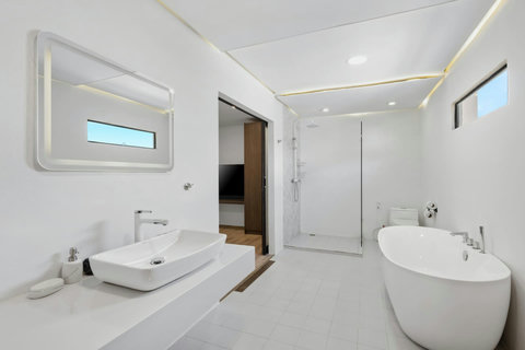 Spa-inspired bathroom with soaking tub and elegant tiling at C'est La Vie Koh Samui villa
