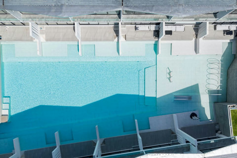 Crystal-clear communal pool with panoramic ocean views at Replay Residence Koh Samui Thailand