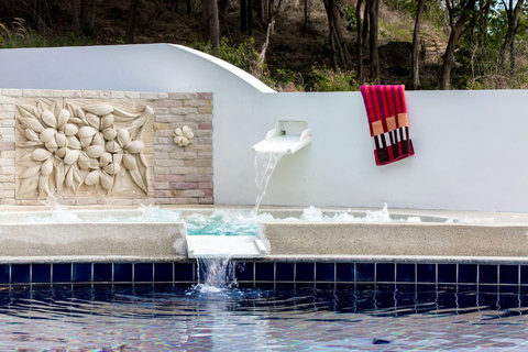 Pool water feature with built-in seating area Thongsong Bay villa