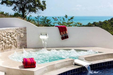 Pool waterfall feature with turquoise accents Thongsong Bay villa