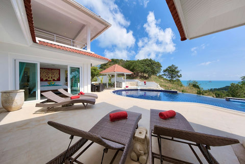 Poolside sun loungers with panoramic sea views luxury Samui villa