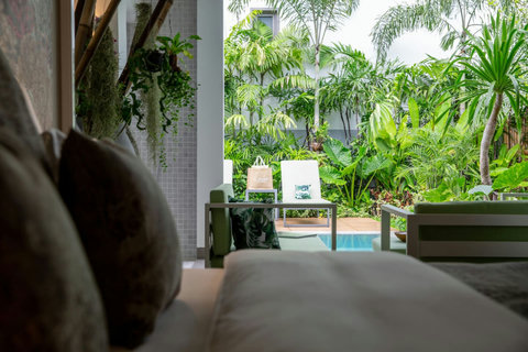Tropical pool area and garden views at C Villa 8-bedroom luxury rental in Koh Samui