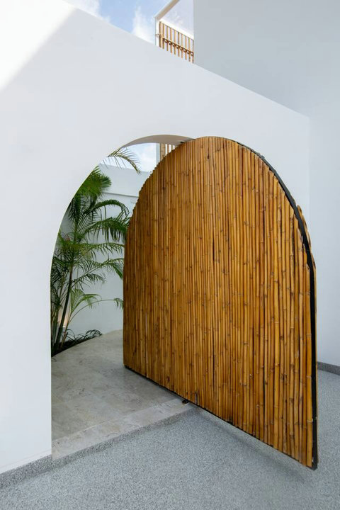 Artistic curved wooden entrance at C Villa art villa in Plai Laem, Koh Samui Thailand