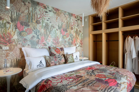 Designer bedroom with botanical cushions at C Villa art retreat in Plai Laem, Koh Samui