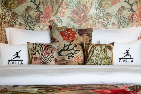 Elegant C Villa branded bedroom with tropical coral bedspread, 8BR luxury Plai Laem retreat