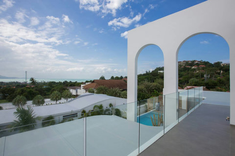 White modern balcony with pool views at C Villa luxury art villa, Plai Laem Thailand