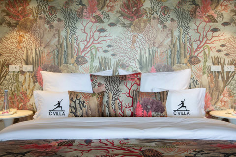 C Villa branded bedroom with tropical bedding and designer pillows, Koh Samui Thailand