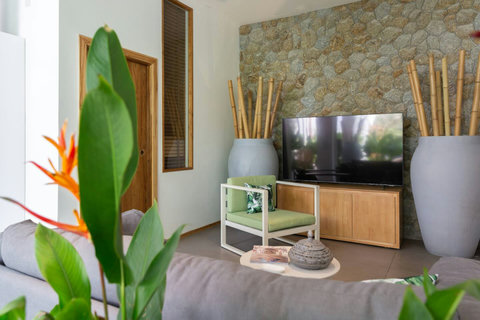 Tropical sitting area with bird of paradise flowers at C Villa art villa, Koh Samui