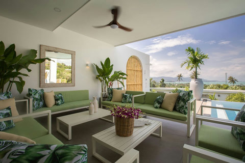 Elegant Moorish-style terrace with outdoor seating at C Villa luxury art villa in Plai Laem, Thailand