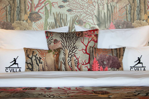 Coral tropical mural bedroom with C Villa branding at luxury art villa, Koh Samui