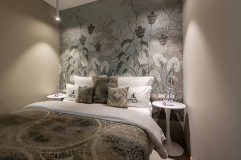 Moody botanical mural bedroom with earthy tones at C Villa art retreat, Koh Samui Thailand