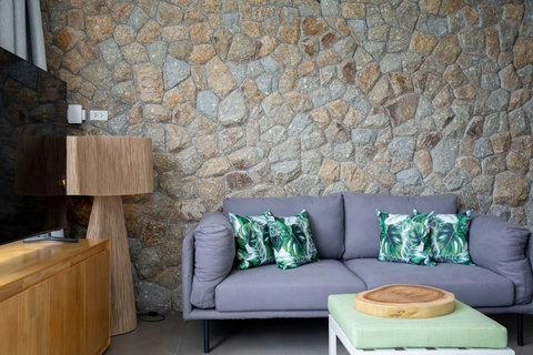 Vibrant tropical living room with colorful art at C Villa vacation rental, Koh Samui Thailand