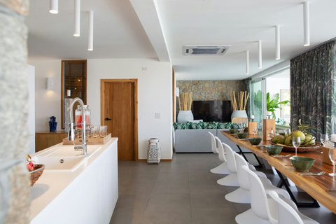 Bright tropical-themed living space with designer art at C Villa luxury Plai Laem rental