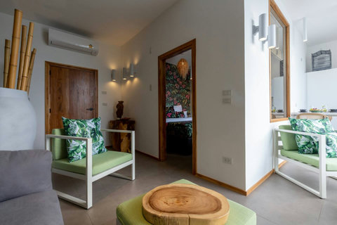 Lush tropical entrance with Balinese-inspired design at C Villa luxury retreat, Koh Samui
