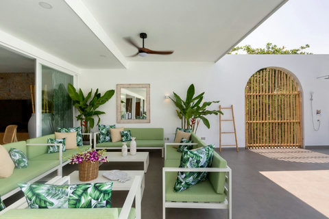 Covered outdoor relaxation area with tropical decor at C Villa 8BR Plai Laem retreat