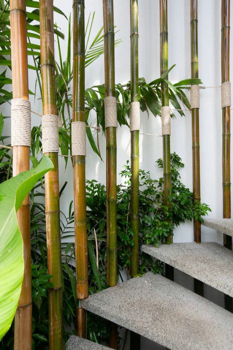 Tropical covered lounge with lush palm garden at C Villa luxury retreat, Koh Samui