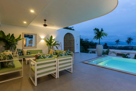 Tropical palm garden with natural bamboo fencing at C Villa vacation rental, Koh Samui
