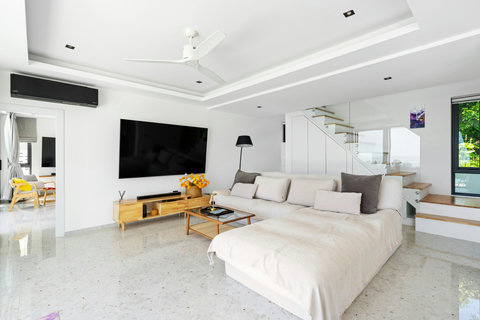 Stylish bedroom with wooden accents and sea views at Villa Maya - 3BR Chaweng Noi Koh Samui
