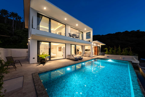 Illuminated pool at night at Villa Maya - 3BR Chaweng Noi luxury villa with sea views Koh Samui