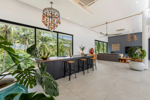Elegant Dining Area with Designer Chandelier at Villa Bond - Luxury Koh Samui Villa with Modern Interior Design and Tropical Views