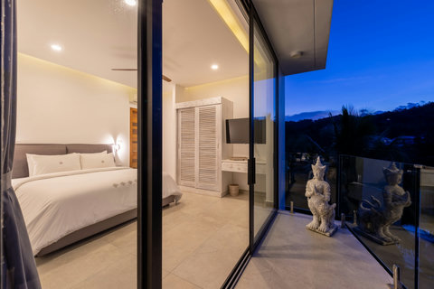 Villa Bond Pool Deck at Twilight - Luxury Koh Samui Holiday Villa with Illuminated Pool and Modern Lounge Area