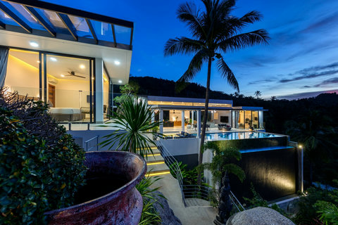 Villa Bond at Dusk with Illuminated Pool - Stunning Evening Views of Luxury Koh Samui Vacation Rental with Modern Architecture