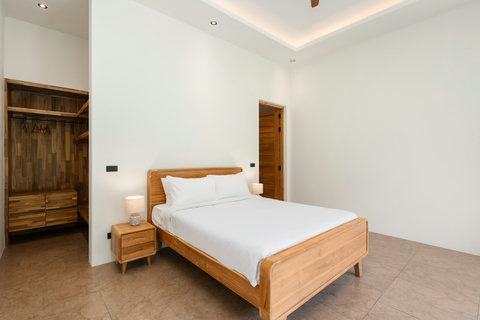 Your private jungle retreat. Lush palms and verdant hills frame the villa, offering complete seclusion and natural serenity.