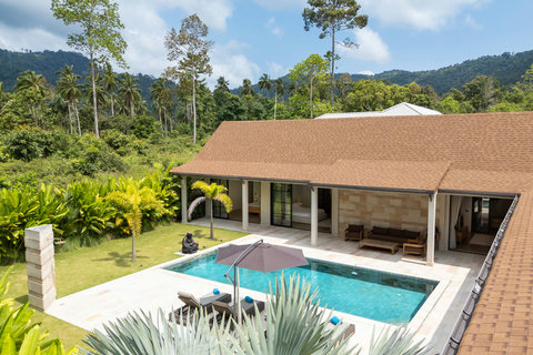 Your private oasis from above. Pool, terrace, and lush greenery create an all-in-one tropical escape without leaving the grounds.
