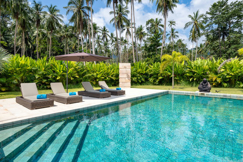 Swim laps or float on your back in this sparkling pool. Palms, shade, and silence are all yours.