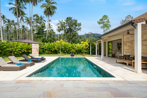 Your private pool beckons. Sink into a lounger, feel the tropical breeze, and watch the hillsides unfold before you.