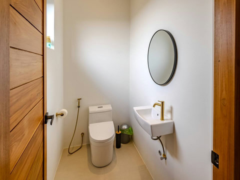A bright, compact ensuite where you can freshen up with an easy walk-in shower and simple sink setup