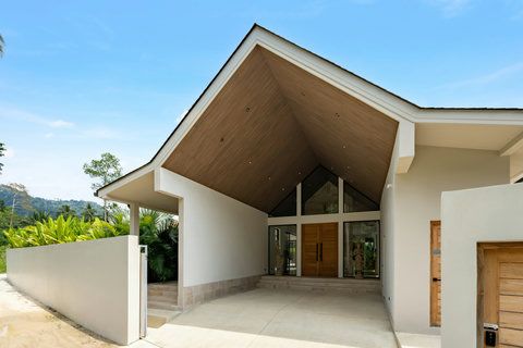 Step onto the cool deck, surrounded by swaying palms and modern comfort. The hillsides frame every moment.
