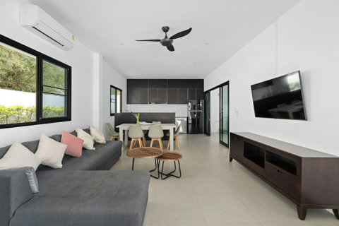 Spacious living room with stylish modern décor and ceiling fan