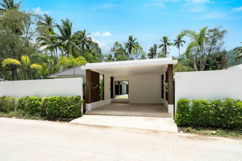 Pool area with modern architectural shade feature