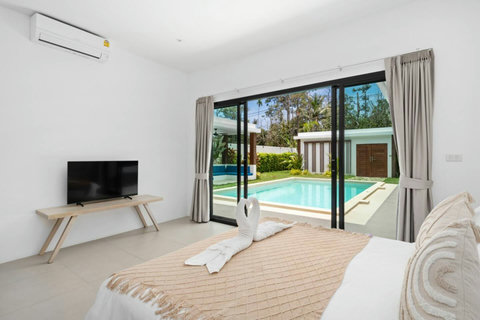 Master bedroom with direct pool access and stunning views