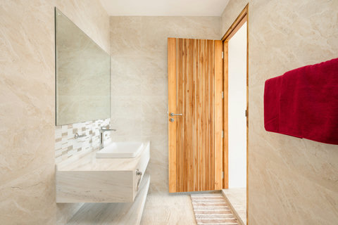 Guest bedroom with wooden furniture and natural light at Villa Gala, Koh Samui