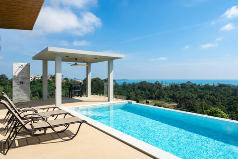 Covered outdoor terrace with pergola and ocean views at Villa Gala, Koh Samui Thailand
