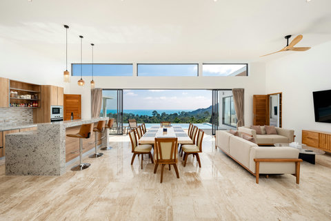 Living room with panoramic sea views through floor-to-ceiling windows at Villa Gala