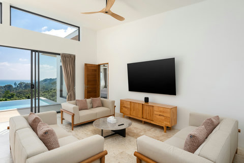 Open-plan dining and living area with panoramic ocean views at luxury Koh Samui villa