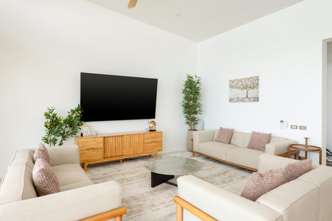 Outdoor entertainment area with comfortable seating and ocean views at Villa Gala