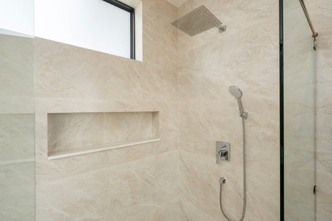 Luxury rainfall shower with marble finishes in ensuite at Villa Gala, Koh Samui