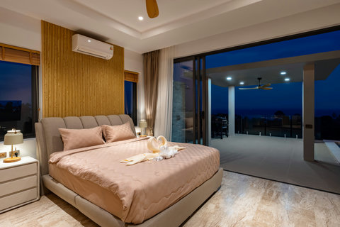 King bedroom with warm lighting and elegant design at Villa Gala, Chaweng Noi