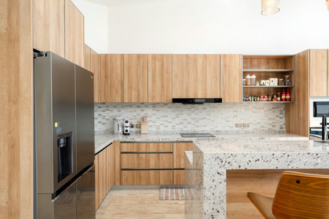 Modern kitchen with stone accents and designer appliances at Villa Gala, Koh Samui