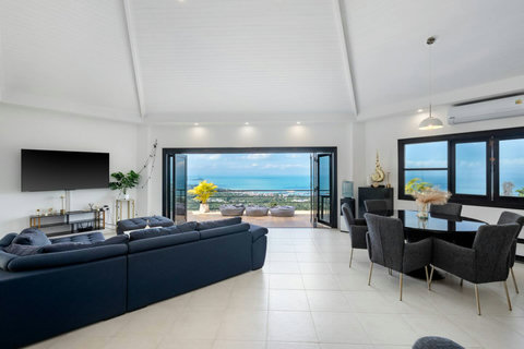 Open-plan living and dining area with high ceiling and sea views at Villa SKY, Nathon Koh Samui