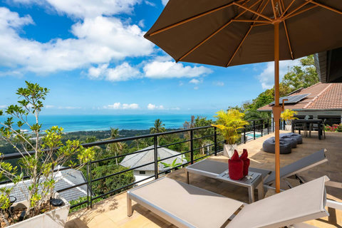 Outdoor terrace with loungers and sea view at Villa SKY, Nathon Paradise Village Koh Samui